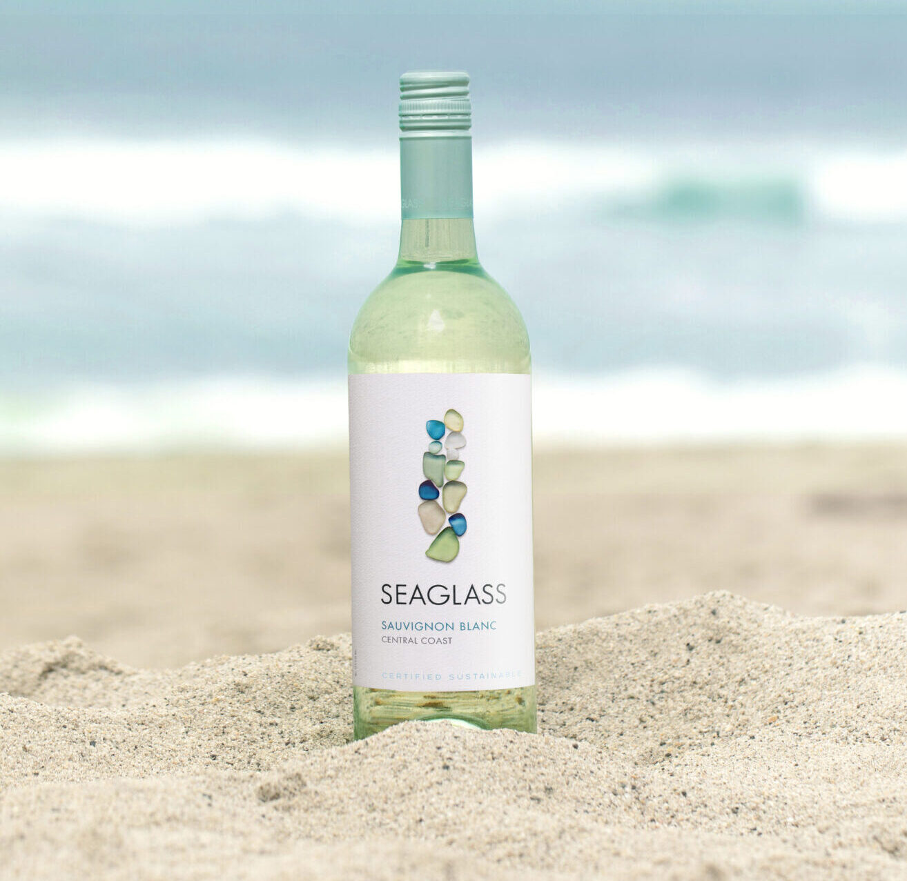 SEAGLASS Sauvignon Blanc bottle in sand