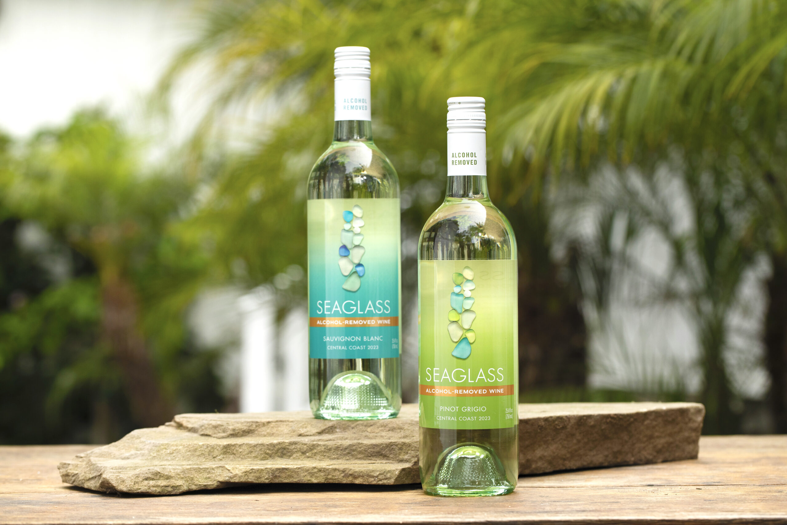 SEAGLASS Alcohol-Removed Sauvignon Blanc and Pinot Grigio on tabletop outdoors