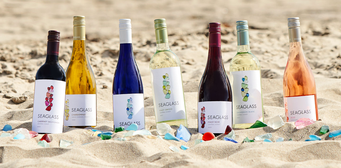 Seaglass wine bottles in the sand